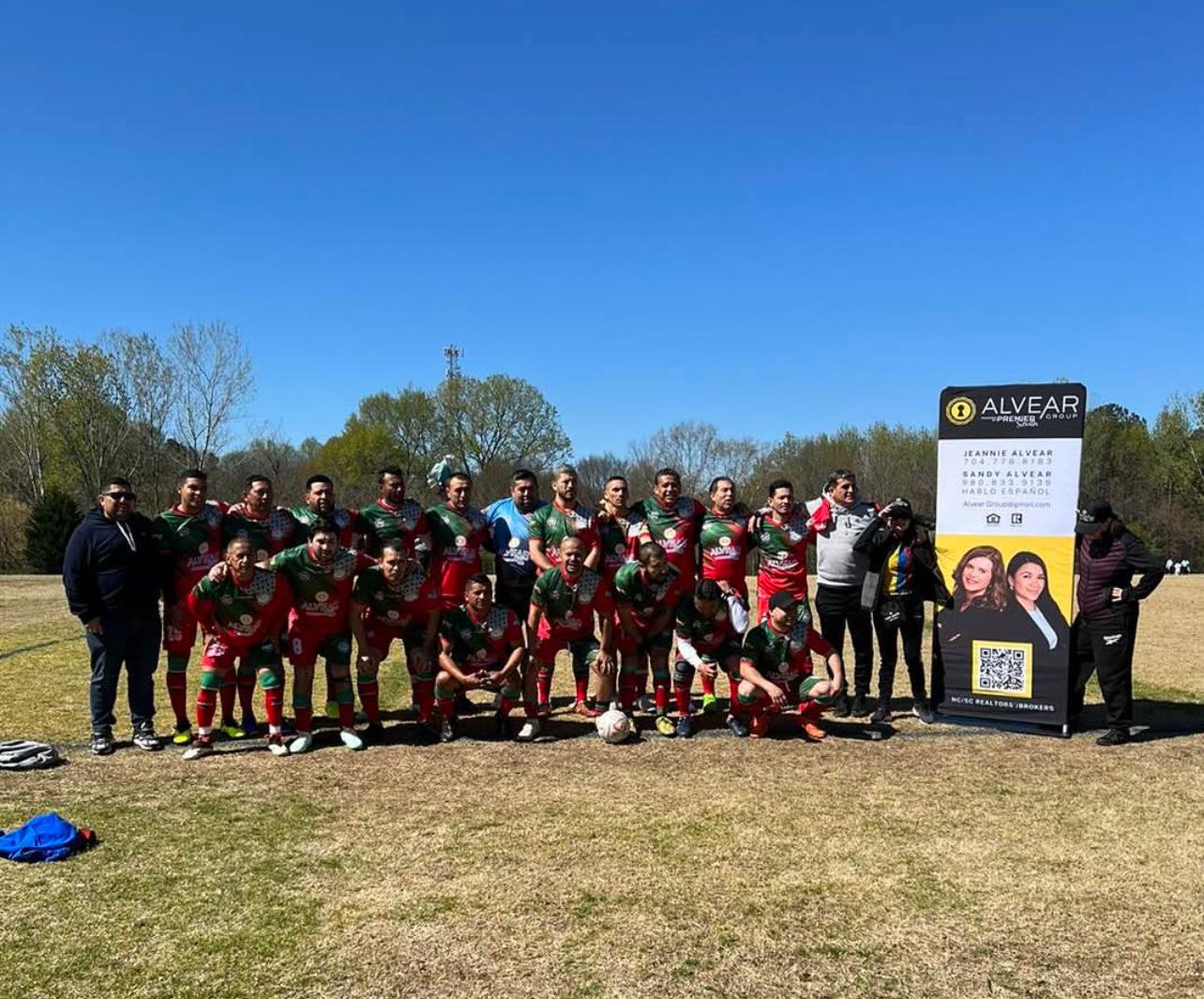 Soccer team sponsored by Alvear Group at community event